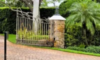 Driveway and gate with iron stains from irrigation system